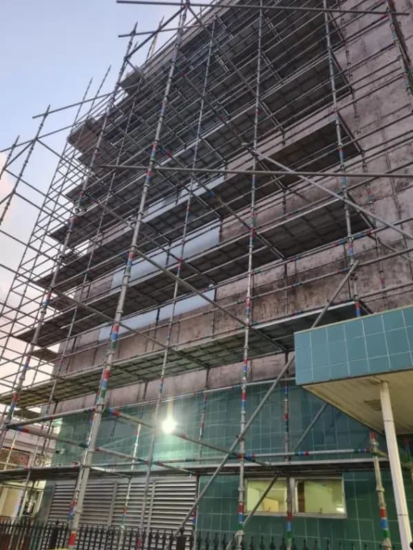Scaffolding to a multi-storey building façade