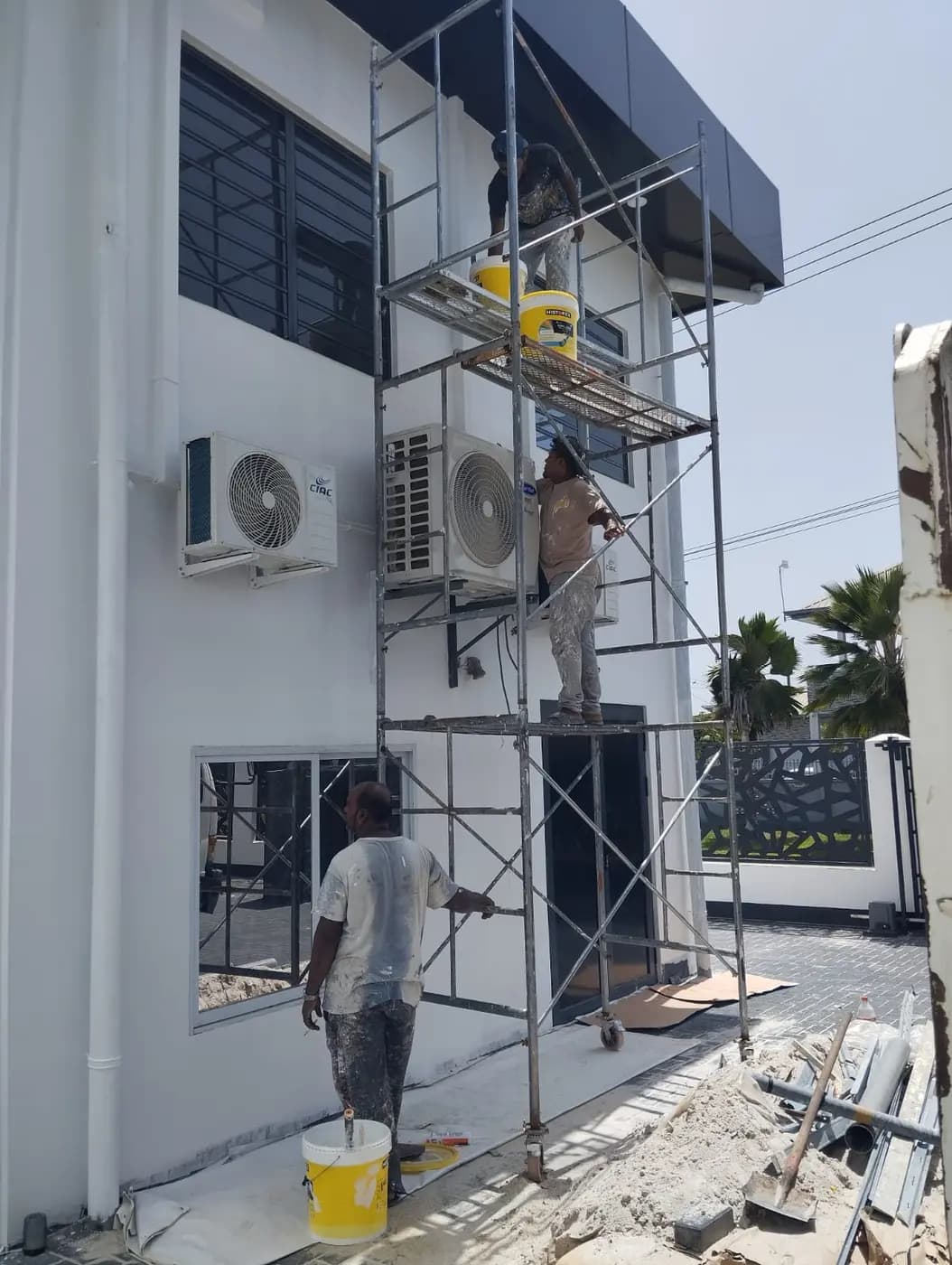 Façade finishing works from scaffolding