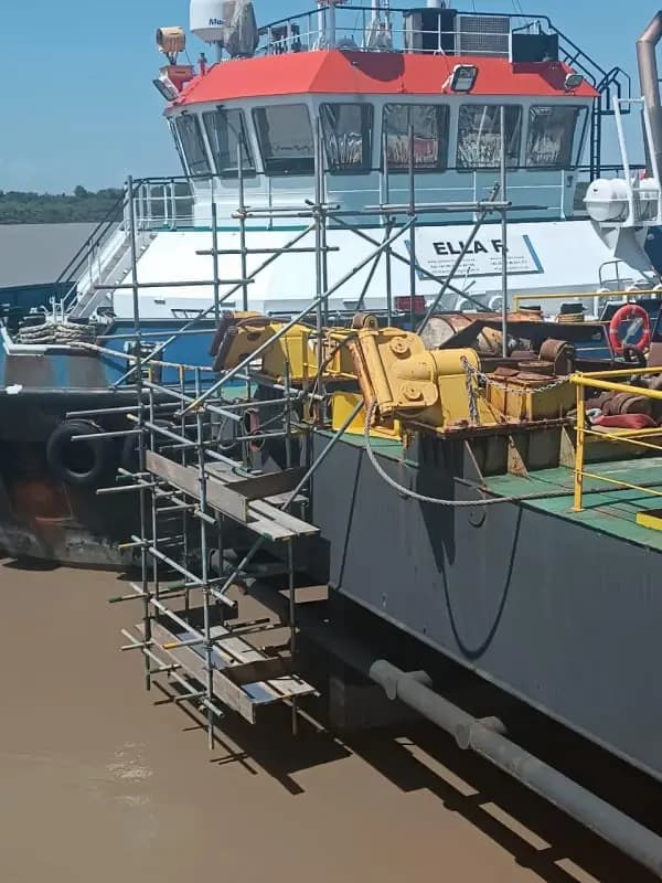 Scaffold platform built alongside a moored vessel