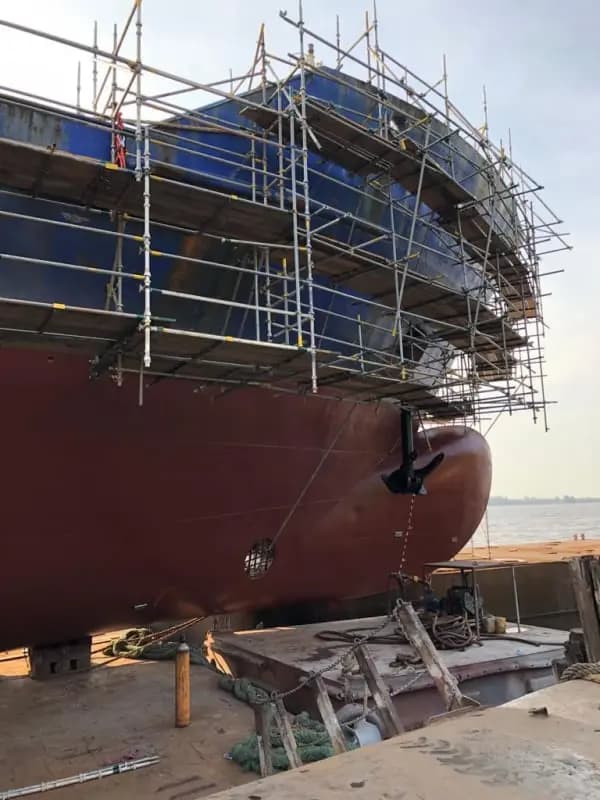 Hull scaffolding erected around a vessel in dry dock